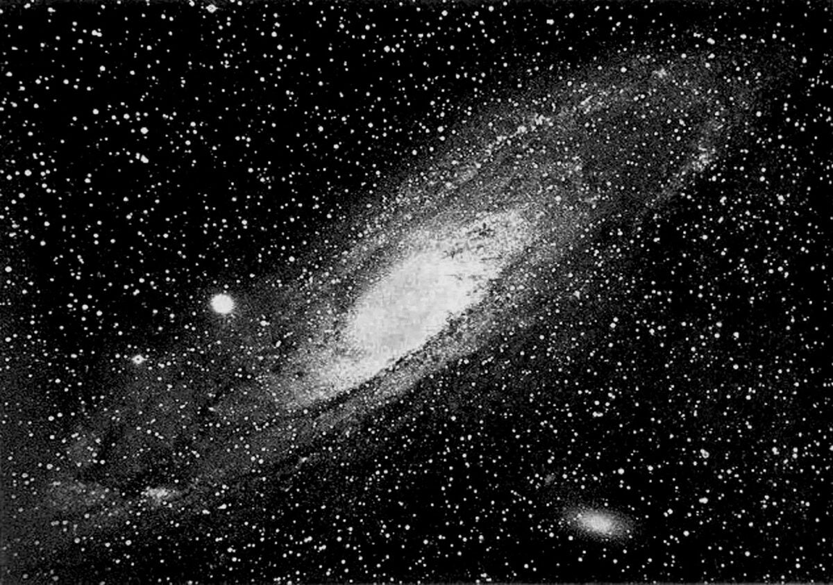 Isaac Roberts’ superb photograph of the Andromeda spiral nebula, as well as its main satellites M32 (middle left) and M110 (bottom right), was taken in 1888 with his 20-inch reflector — part of his twin telescope designed by Howard Grubb of Dublin. 