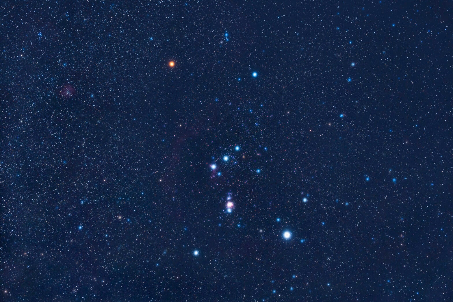 The constellation Orion the Hunter hosts two of the 10 brightest stars in the sky, Betelgeuse and Rigel. At magnitude 0.5 and 0.2, respectively, Betelgeuse (orange star at upper left) and Rigel (blue-white star at lower right) stand in stark contrast to many of the surrounding stars.