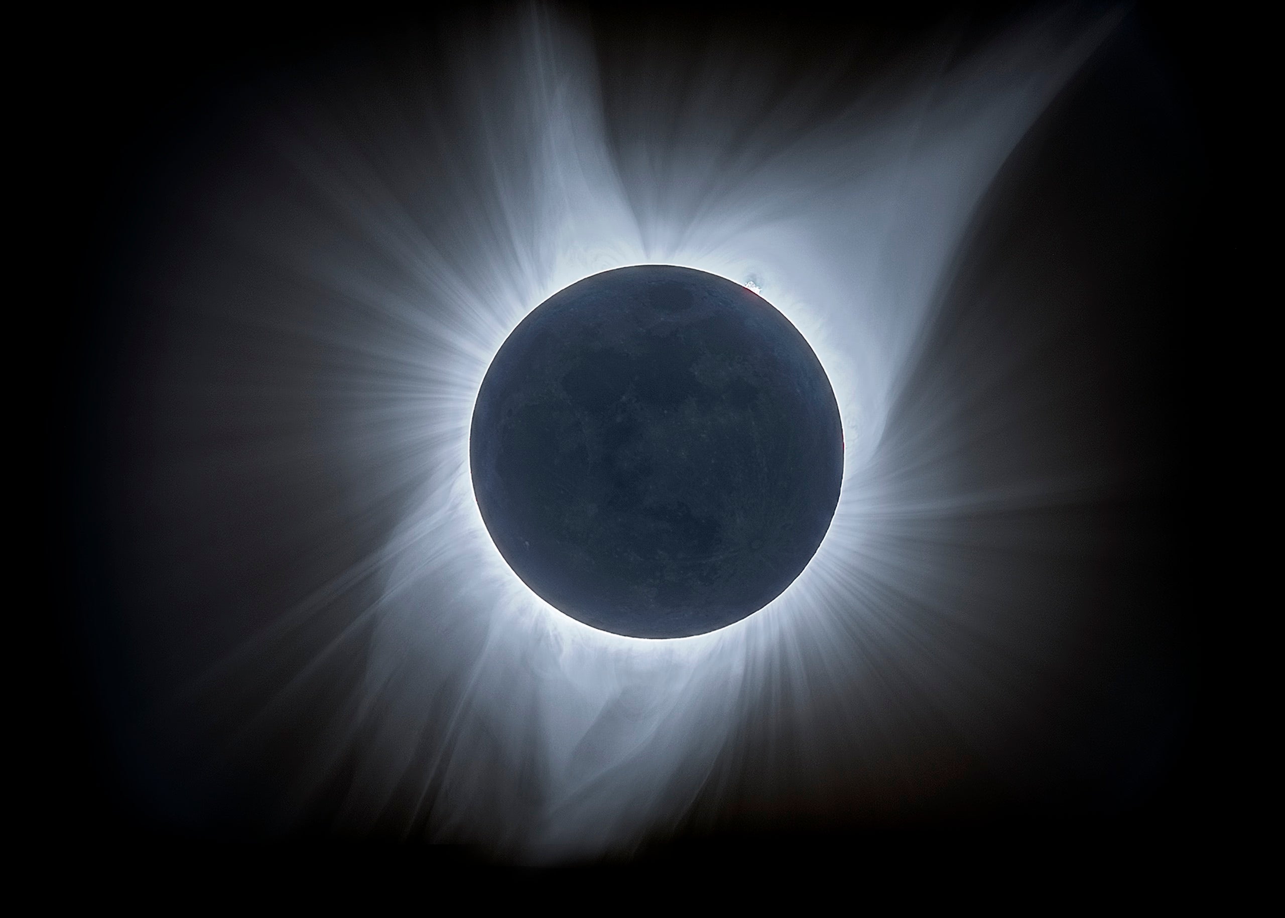 The corona is made of hot, glowing plasma flying off of the Sun. It can only be seen when the Sun is completely eclipsed. Credit: Blake Estes