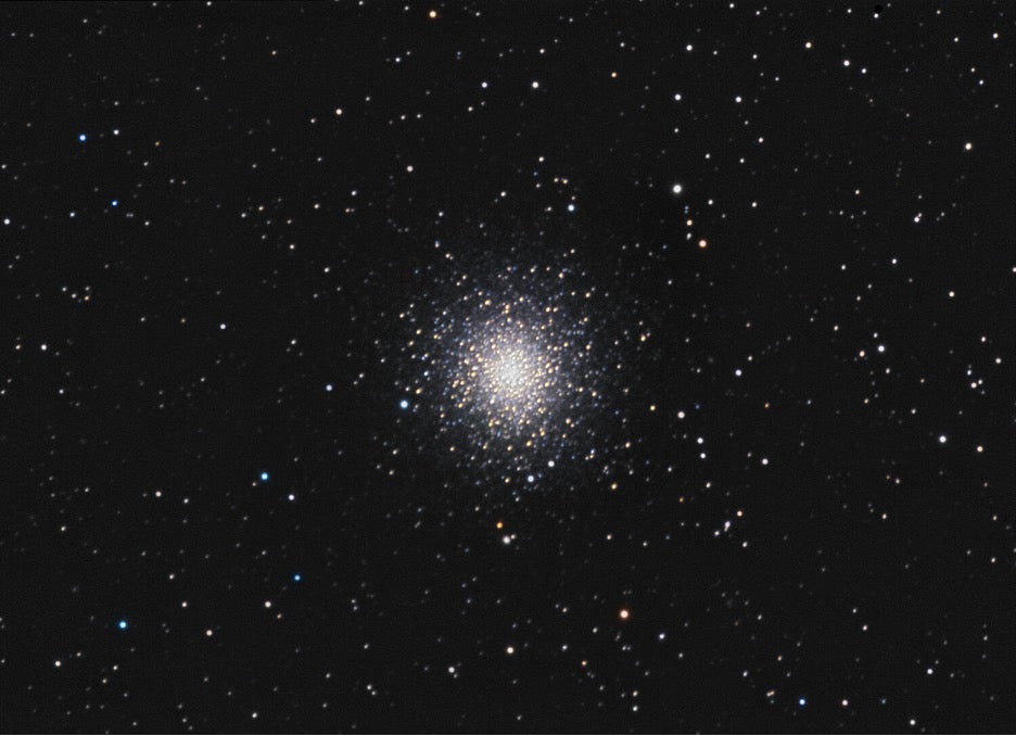 M2 features dark lanes arcing and branching across its northwest quadrant (lower right of this image) that can be seen visually through a telescope.