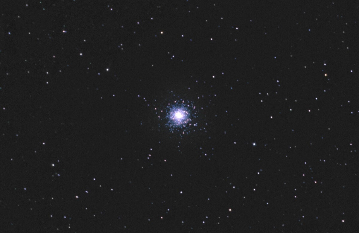 M79 is a wintertime globular in the southern constellation Lepus, south of Orion. The arc of stars above the core doubles back on itself in a V-shape on its left side, then trails off to the left.