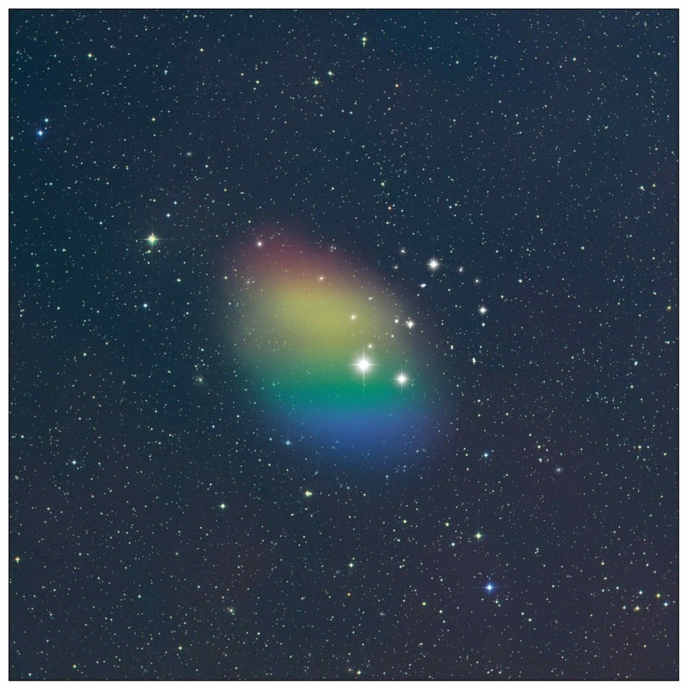 An artist's depiction of the rotation of hydrogen in a galaxy shows a round collection of colors to indicate the position of gases relative to the observer.