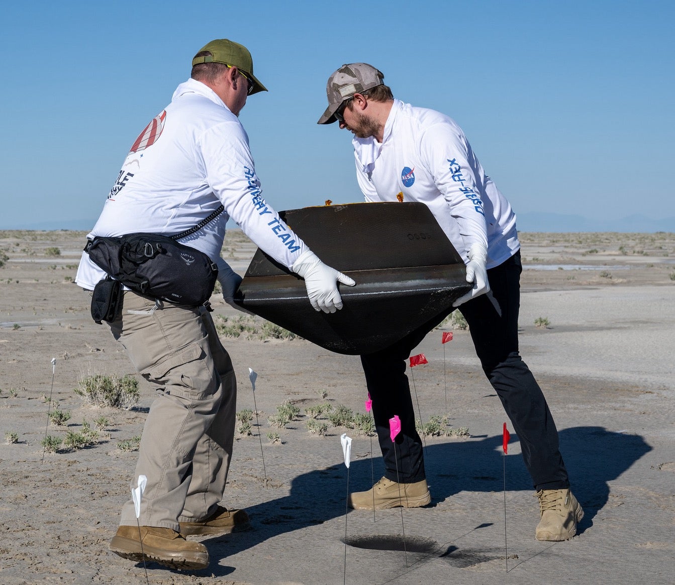 Collecting the OSIRIS-REx sample return capsule. Credit: NASA/Keegan Barber, CC BY.