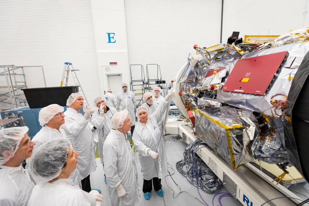 A 90-year-old Eugene Parker (center) visits the Parker Solar Probe — named for him — in a clean room at the Johns Hopkins Applied Physics Laboratory in Laurel, Maryland, in 2017, prior to its launch. Parker died in 2022 aged 94. 